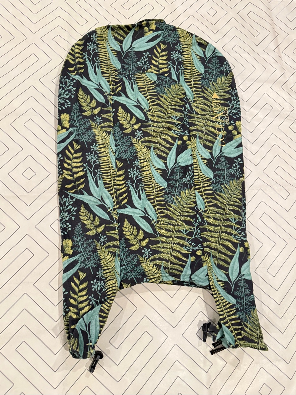 DockATot Deluxe+ Black with Green Leaf Print Cover